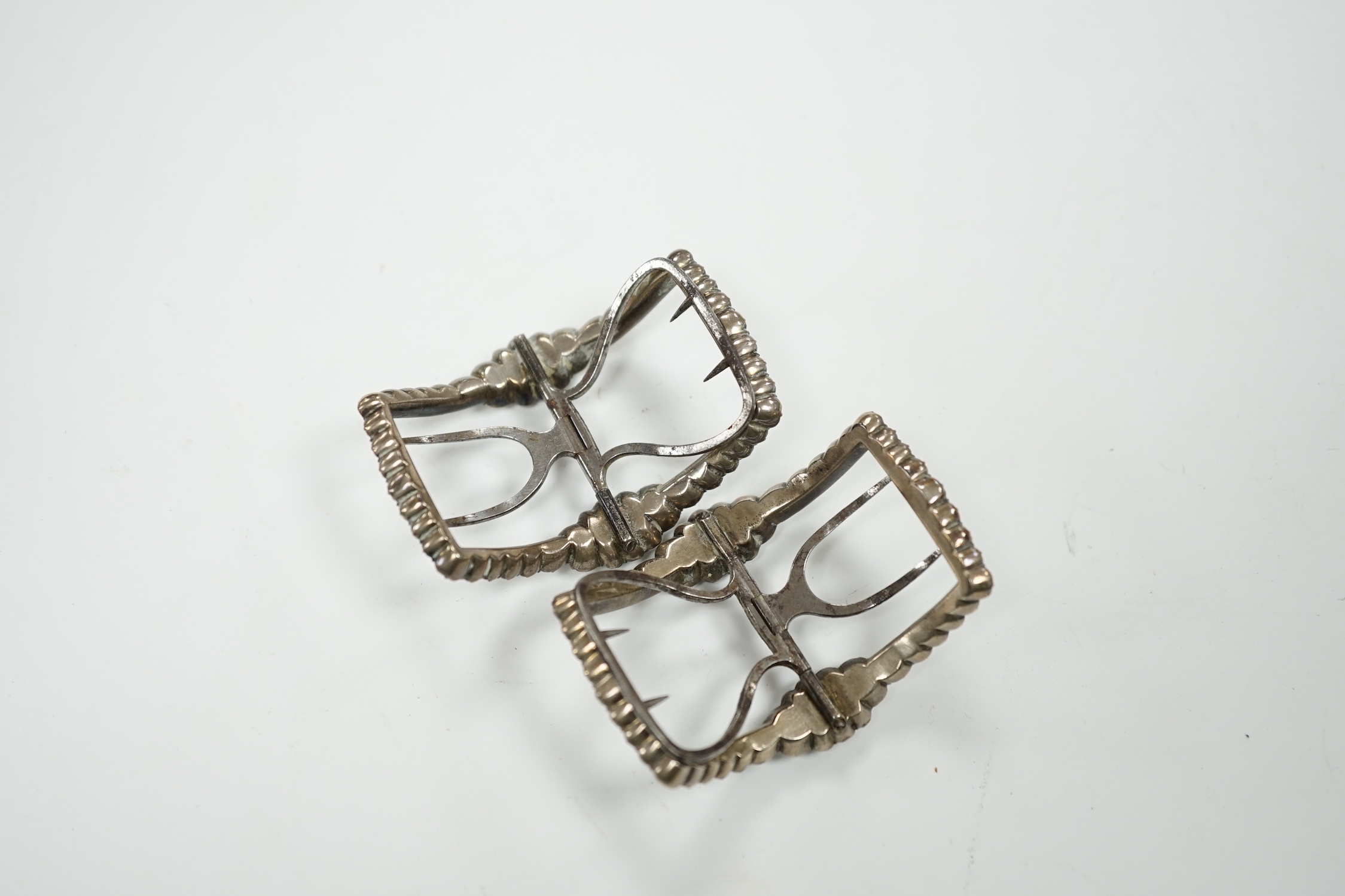 A cased pair of Georgian white metal, steel and white paste cluster set shoe buckles, 58mm, in original box